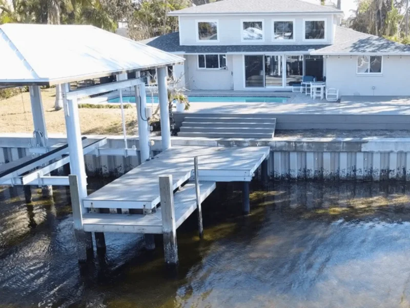 Custom designed and built deck and dock for a house on the water